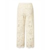 Pack shot af Nué Notes Miami Pants Egret Ecru blonde bukser set bagfra på hvid baggrund