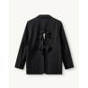 Pack shot af The Garment Pluto Bow Blazer Black bagfra på neutral baggrund